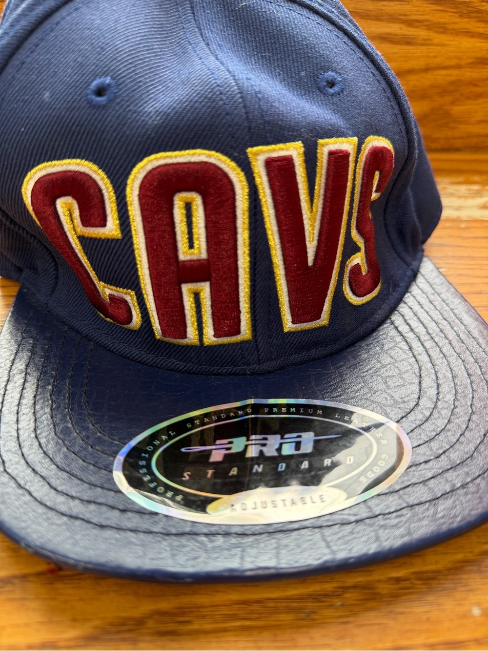 CAVS Navy Snapback Hat with Maroon & Gold Appliqué